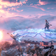 Aloy rides atop a giant robo-platform-giraffe, looking at the sunset.